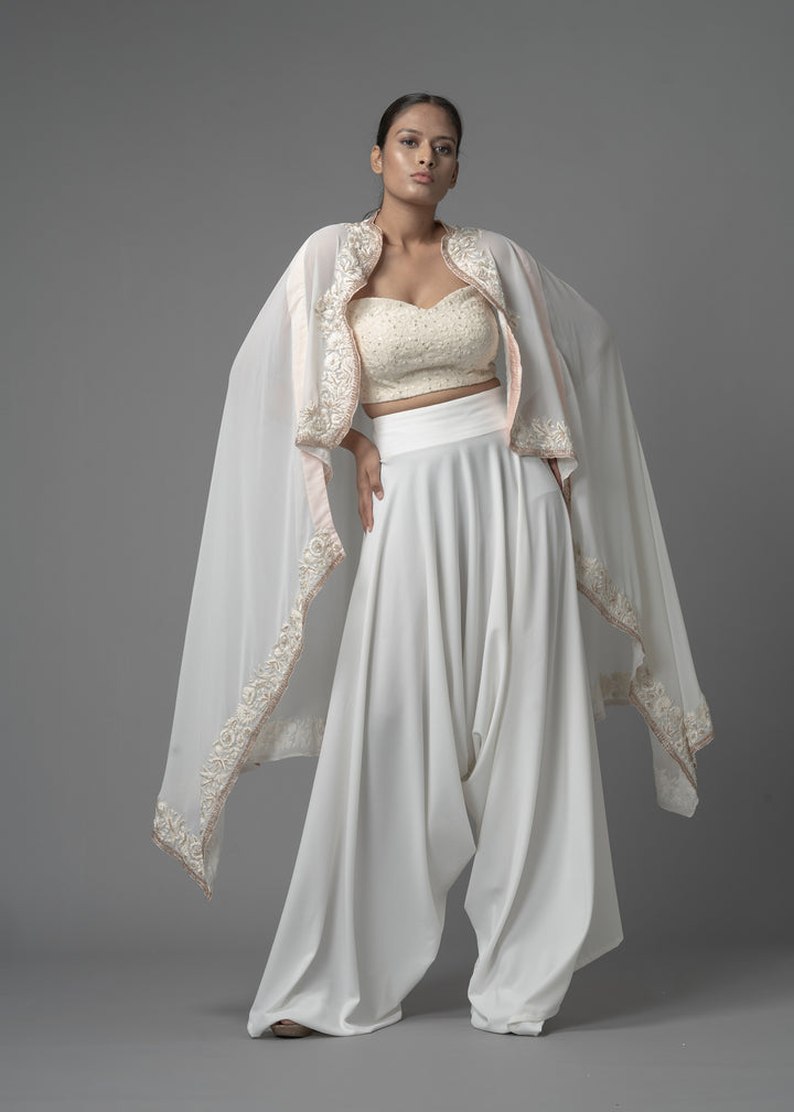 EMBELISHED CAPE PAIRED WITH BUSTIER AND COWL PANTS
