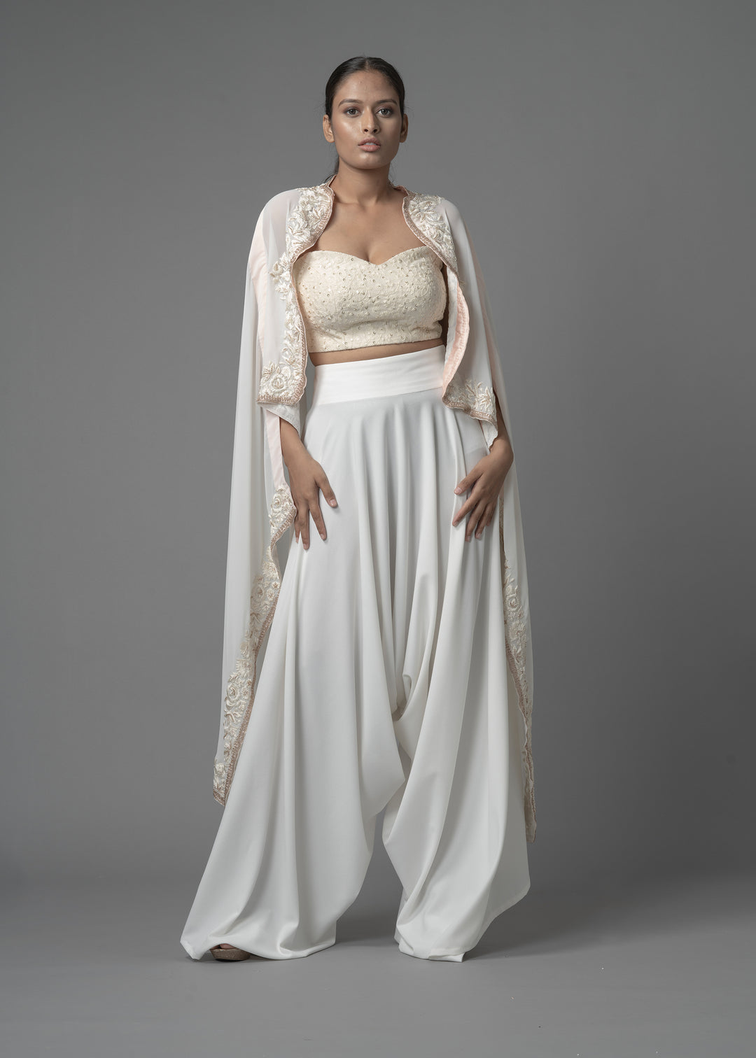 EMBELISHED CAPE PAIRED WITH BUSTIER AND COWL PANTS